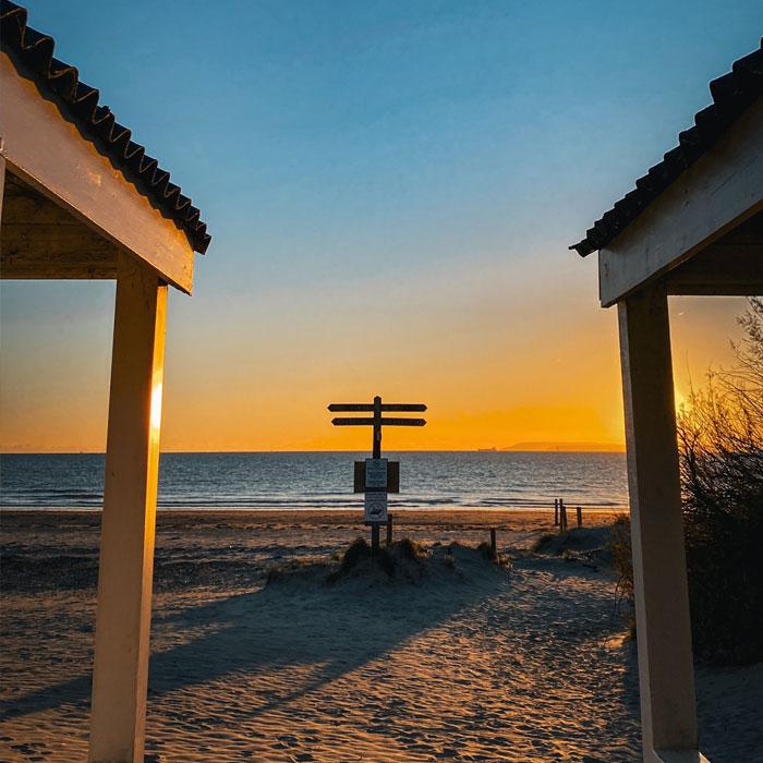 Witterings beach image with sign