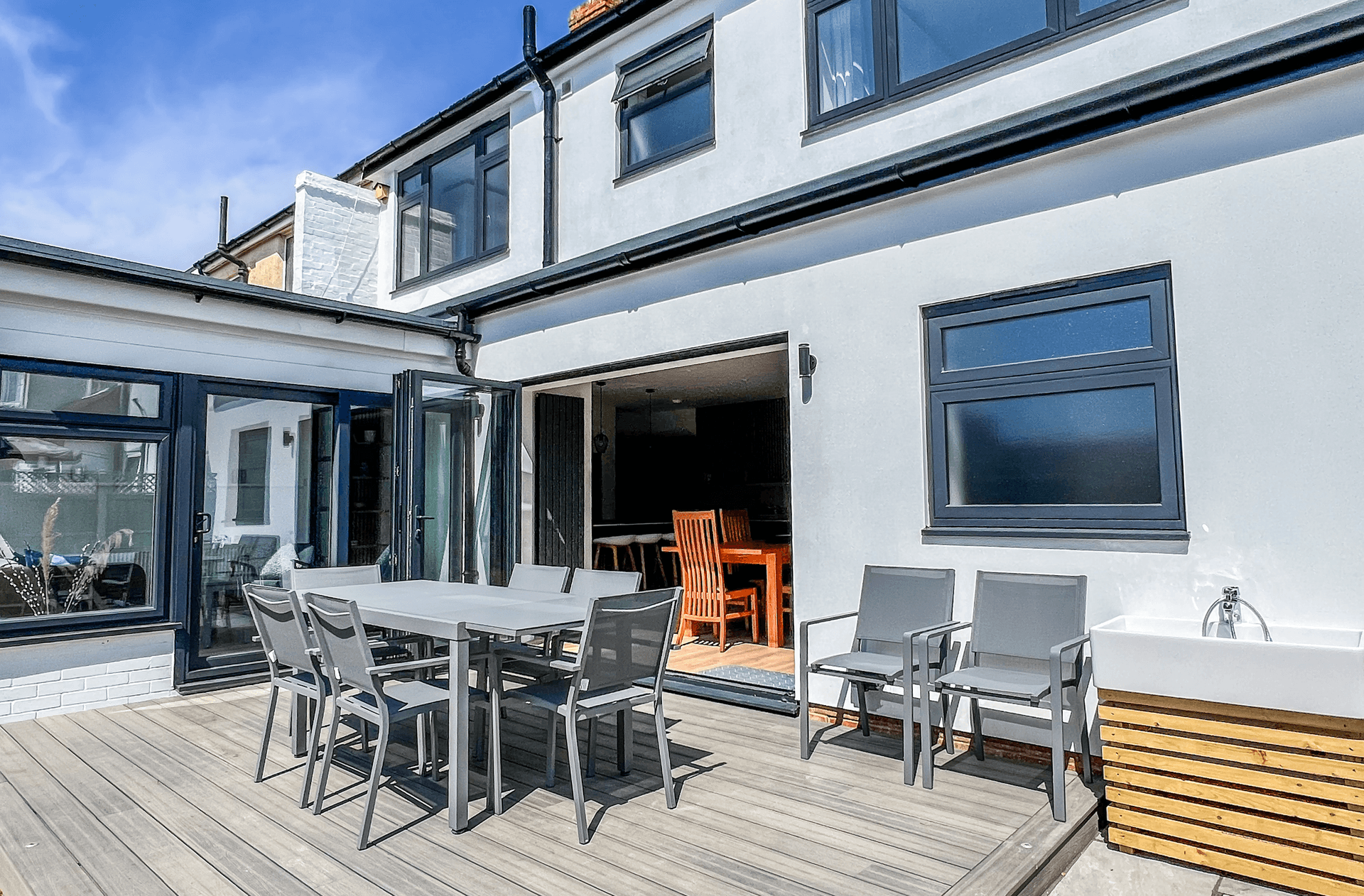 Ocean Grove Image A terrace area with seating and an entrance to the house.