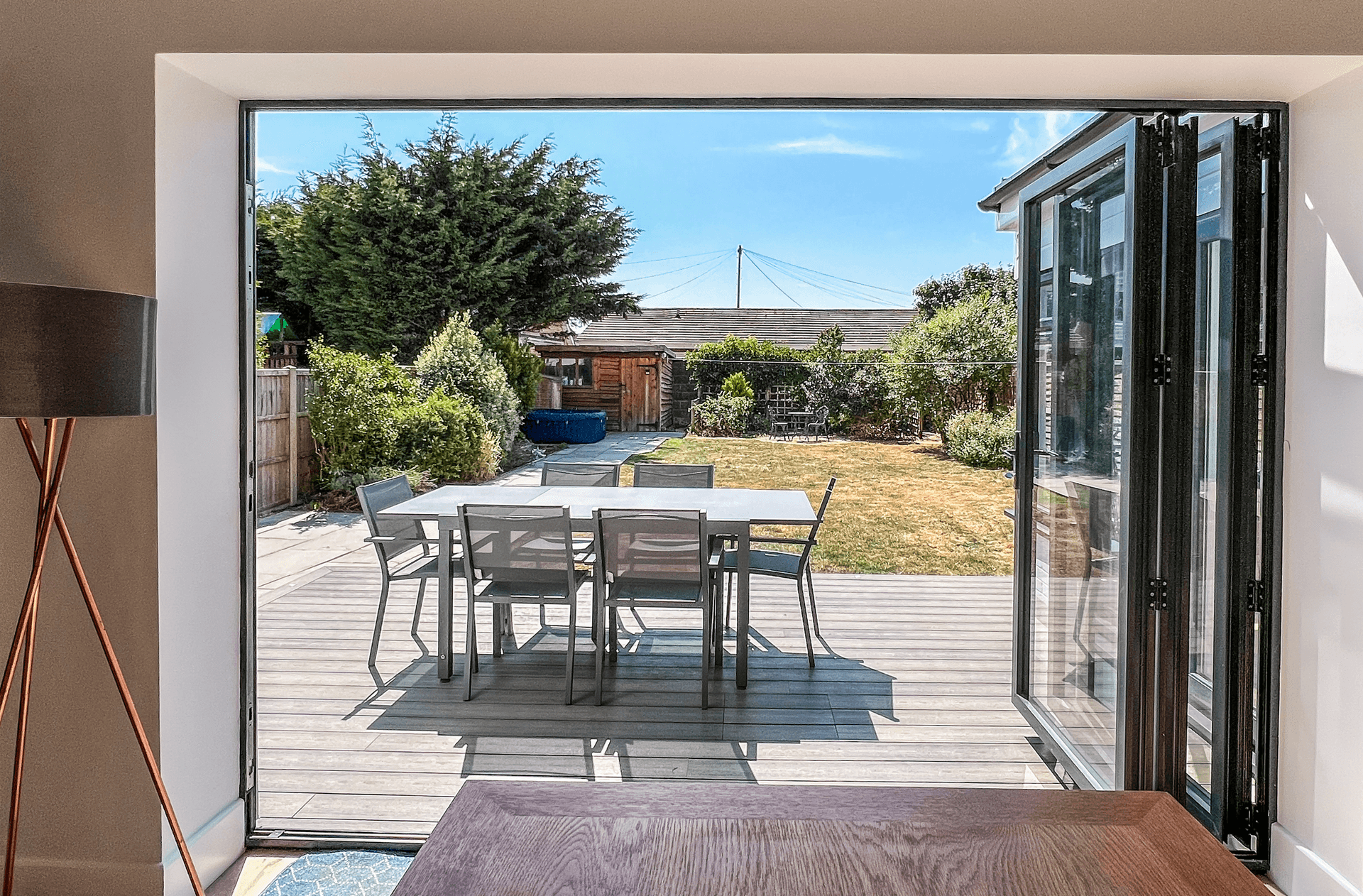 Ocean Grove Image A set of doors opens out onto a patio terrace and a garden in the Witterings.